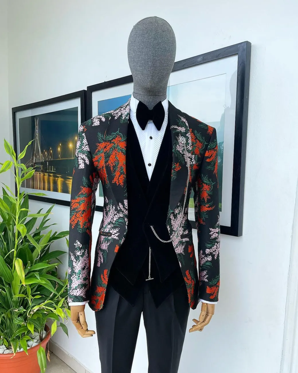 A “spring” orange, pink and green splashed floral layered front cut, shawl lapel tuxedo suit