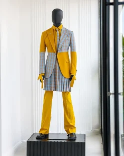 A “Square Shattered” yellow and broken tartan check in sapphire blue mix peak lapel suit