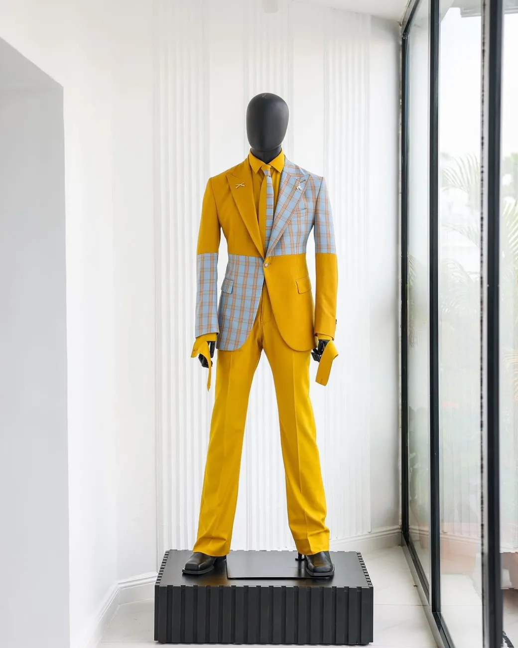 A “Square Shattered” yellow and broken tartan check in sapphire blue mix peak lapel suit
