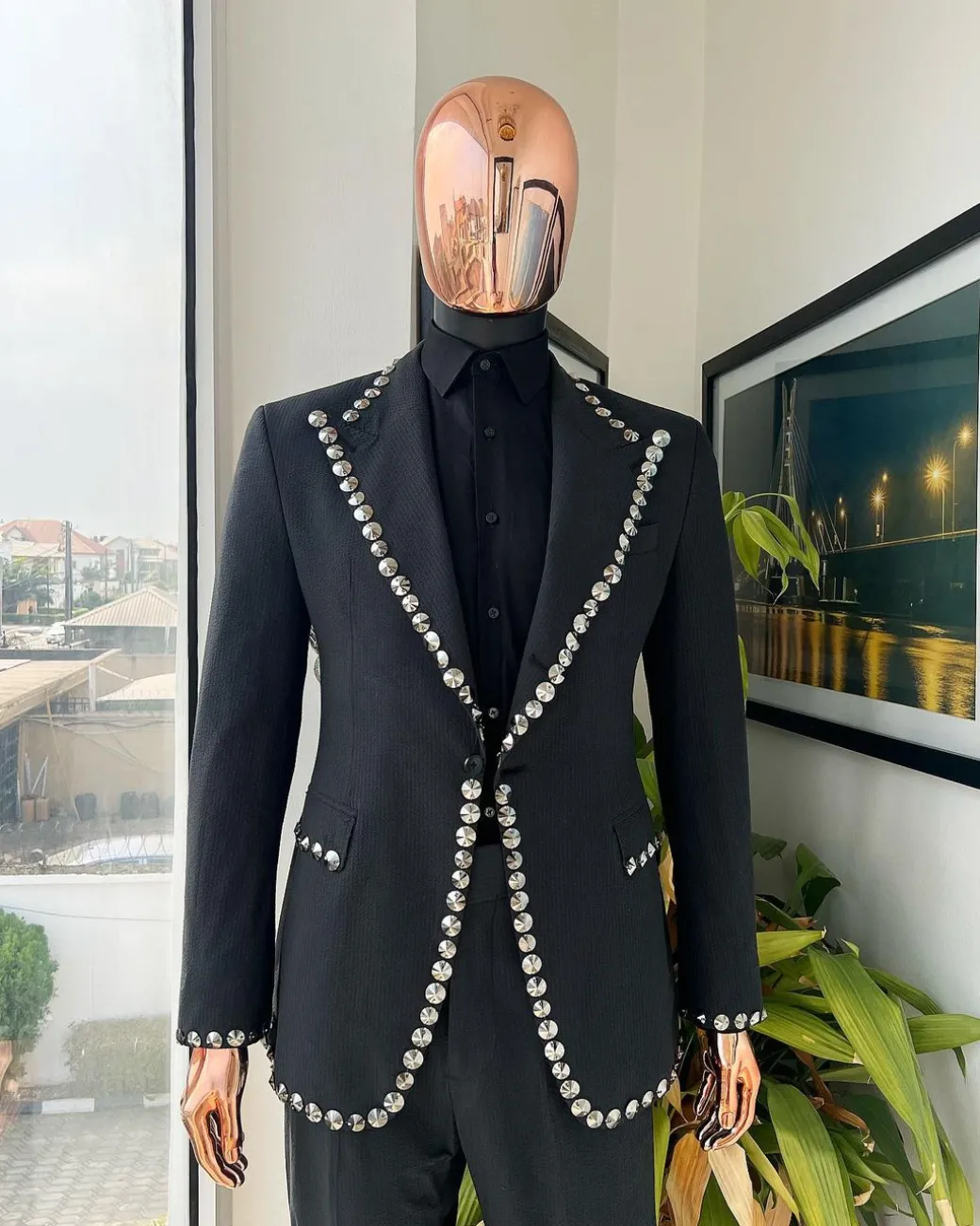 A steel black, seer sucker fabric, knitted, peak lapel suit