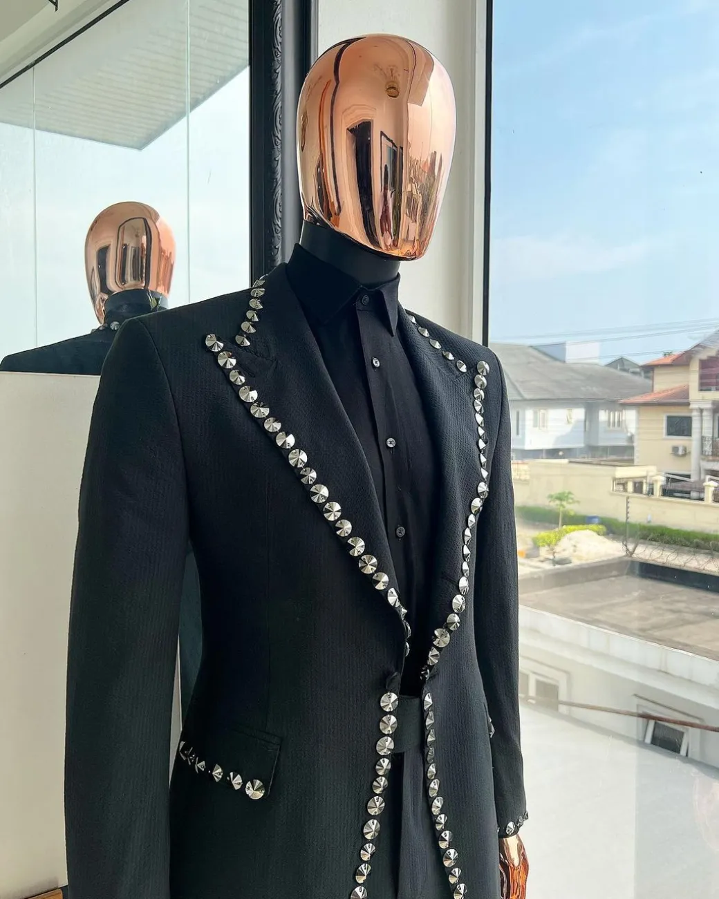 A steel black, seer sucker fabric, knitted, peak lapel suit