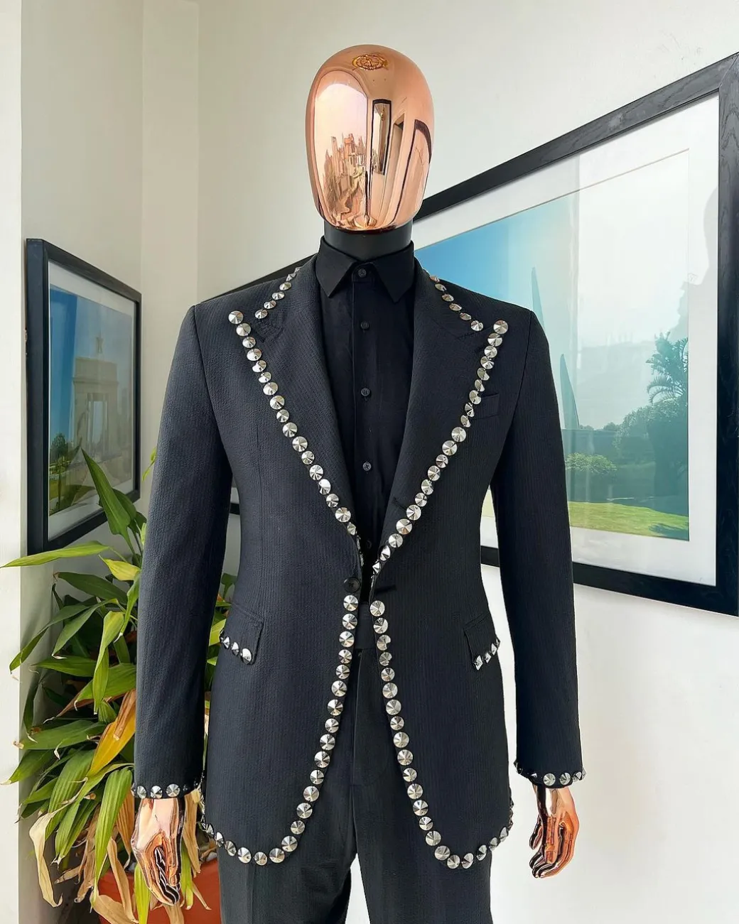 A steel black, seer sucker fabric, knitted, peak lapel suit