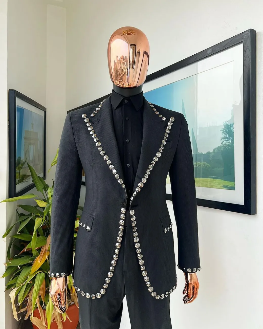 A steel black, seer sucker fabric, knitted, peak lapel suit