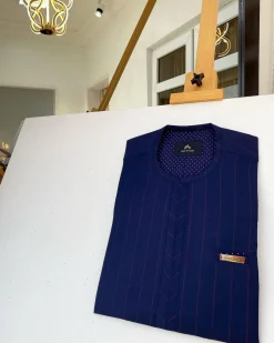 A Stripe Navy Blue and red kaftan with pen hole details and Sokoto