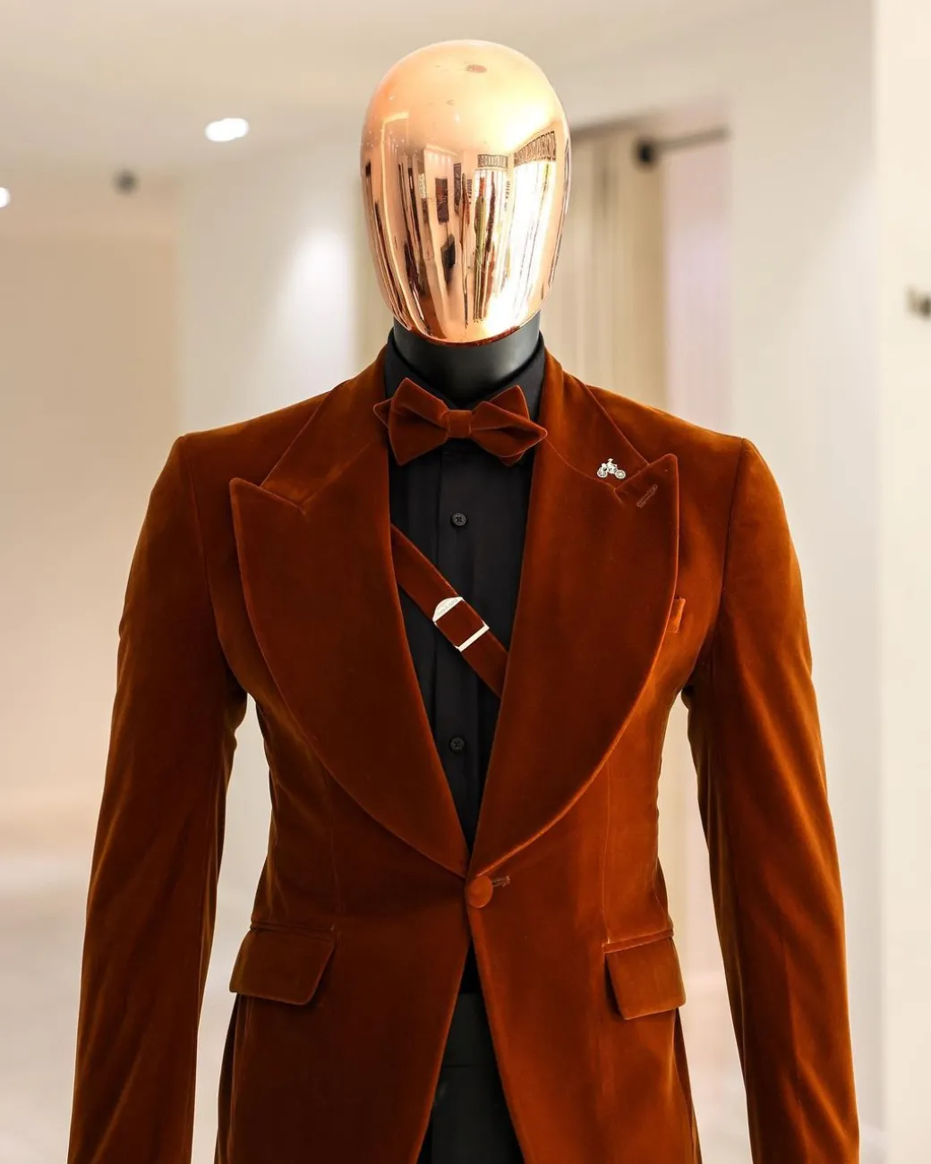 A Syrup Brown, Peak Lapel Tuxedo Suit With An Inner Slant Anchor.