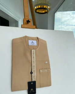 A Tan brown, embroidery front flap, and patch pocket African traditional kaftan native