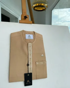 A Tan brown, embroidery front flap, and patch pocket African traditional kaftan native
