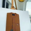 A Tawny brown, front flap, patch pocket, matching Swarovski buttons, paisley detailing African senator kaftan native.