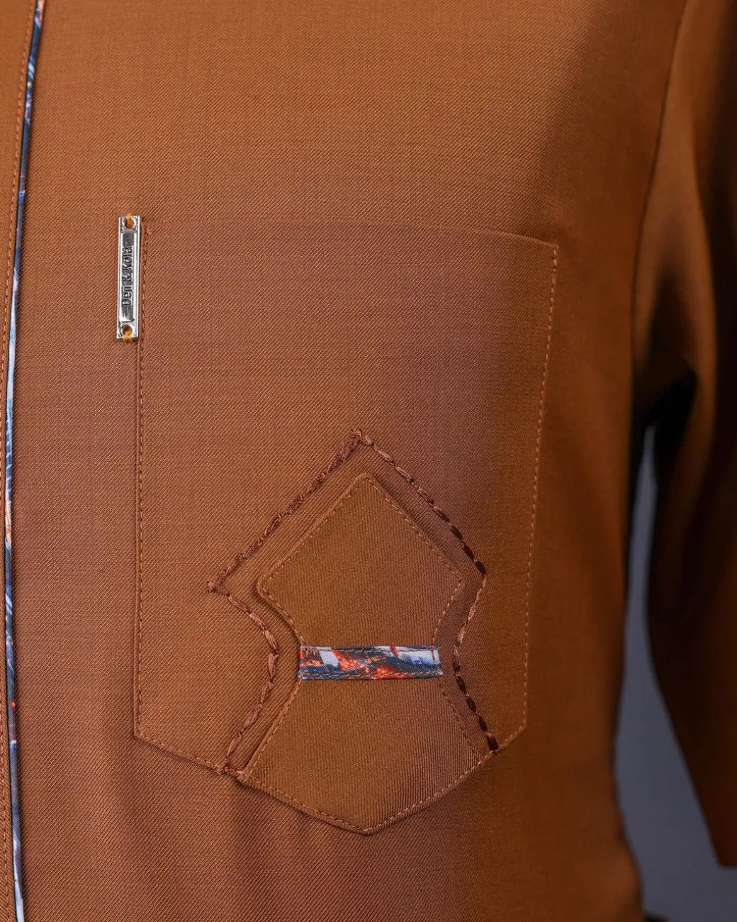 A Tawny brown, Front flap, patch pocket, short sleeve details African senator kaftan native.
