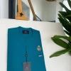 A teal green, tiny flap, and gold bee crown detail an African traditional senator kaftan native.