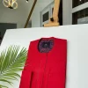 A Tomato Red Kaftan, With mixed blue and red paisley detailing and sokoto