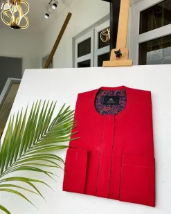 A Tomato Red Kaftan, With mixed blue and red paisley detailing and sokoto