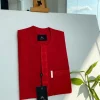 A tomato red, slanted vertical front flap & pocket embroidery detailing african traditional senator kaftan native.