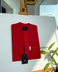 A tomato red, slanted vertical front flap & pocket embroidery detailing african traditional senator kaftan native.