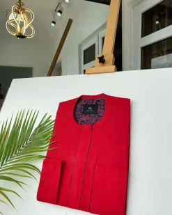 A Tomato-Red Kaftan With mixed blue and red paisley detailing