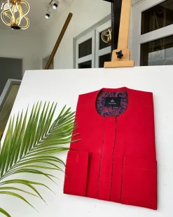 A Tomato-Red Kaftan With mixed blue and red paisley detailing