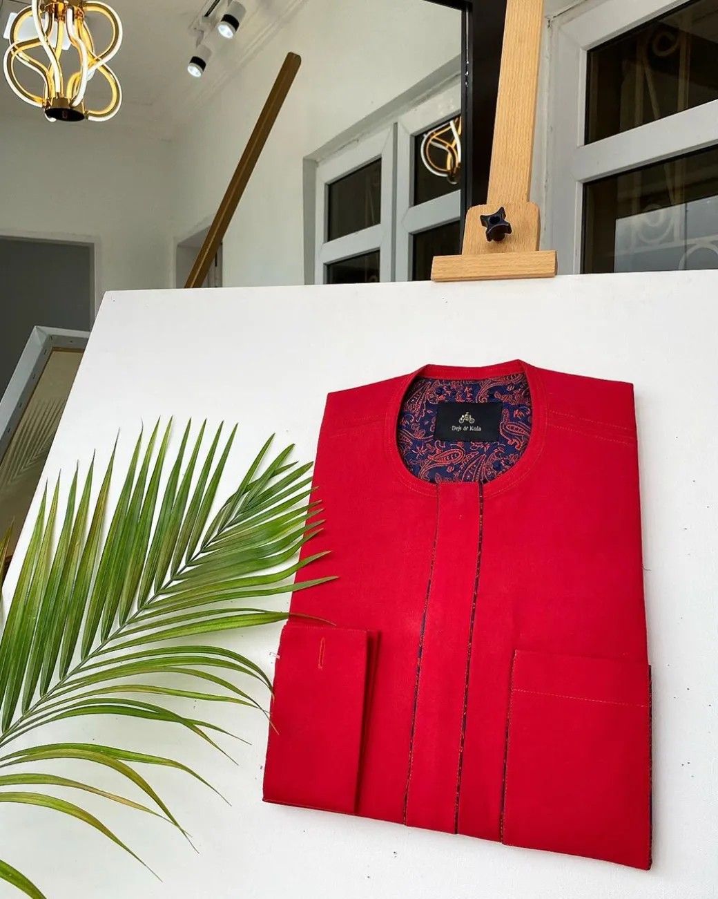 A Tomato-Red Kaftan With mixed blue and red paisley detailing