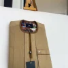 A Tortilla and brunette brown mix, patch pocket, and zipline flap detail African traditional senator kaftan native