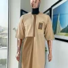 A tortilla and peanut brown, gold metallic jacquard detailing African traditional senator kaftan native