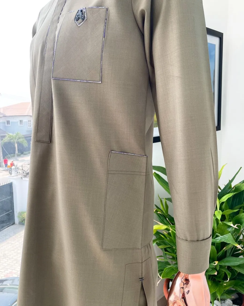 A Tortilla brown, black Swarovski button with purple paisley detailing with side patch pocket african traditional senator kaftan native.