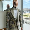 A Tortilla brown, emerald green, gold and splash of burgundy metallic floral jacquard peak lapel tuxedo suit