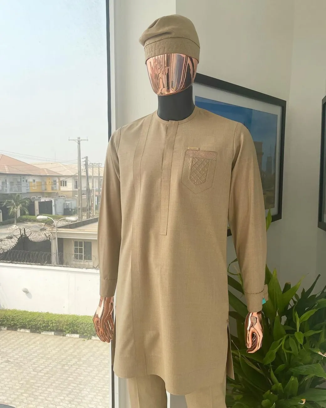 A tortilla brown, front flap, and ruffle pocket detail African traditional senator kaftan native