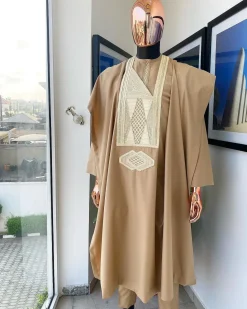 A Tortilla Brown, interconnected embroidery details agbada, buba and sokoto