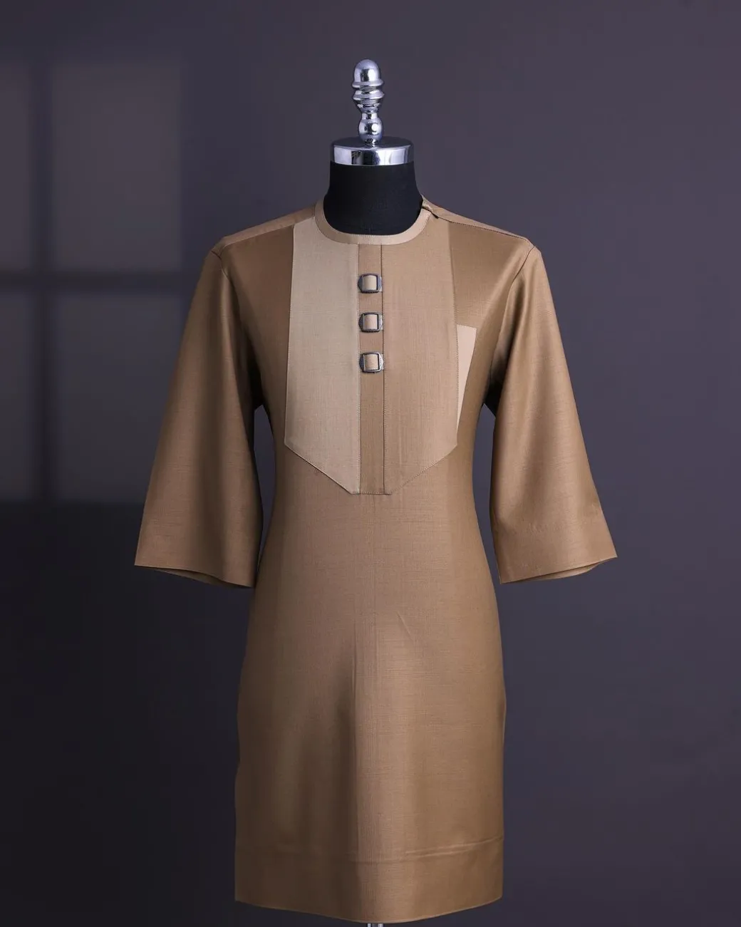 A Tortilla brown, invisible zip, black connected metal tag, 3/4 sleeve traditional african senator kaftan native.
