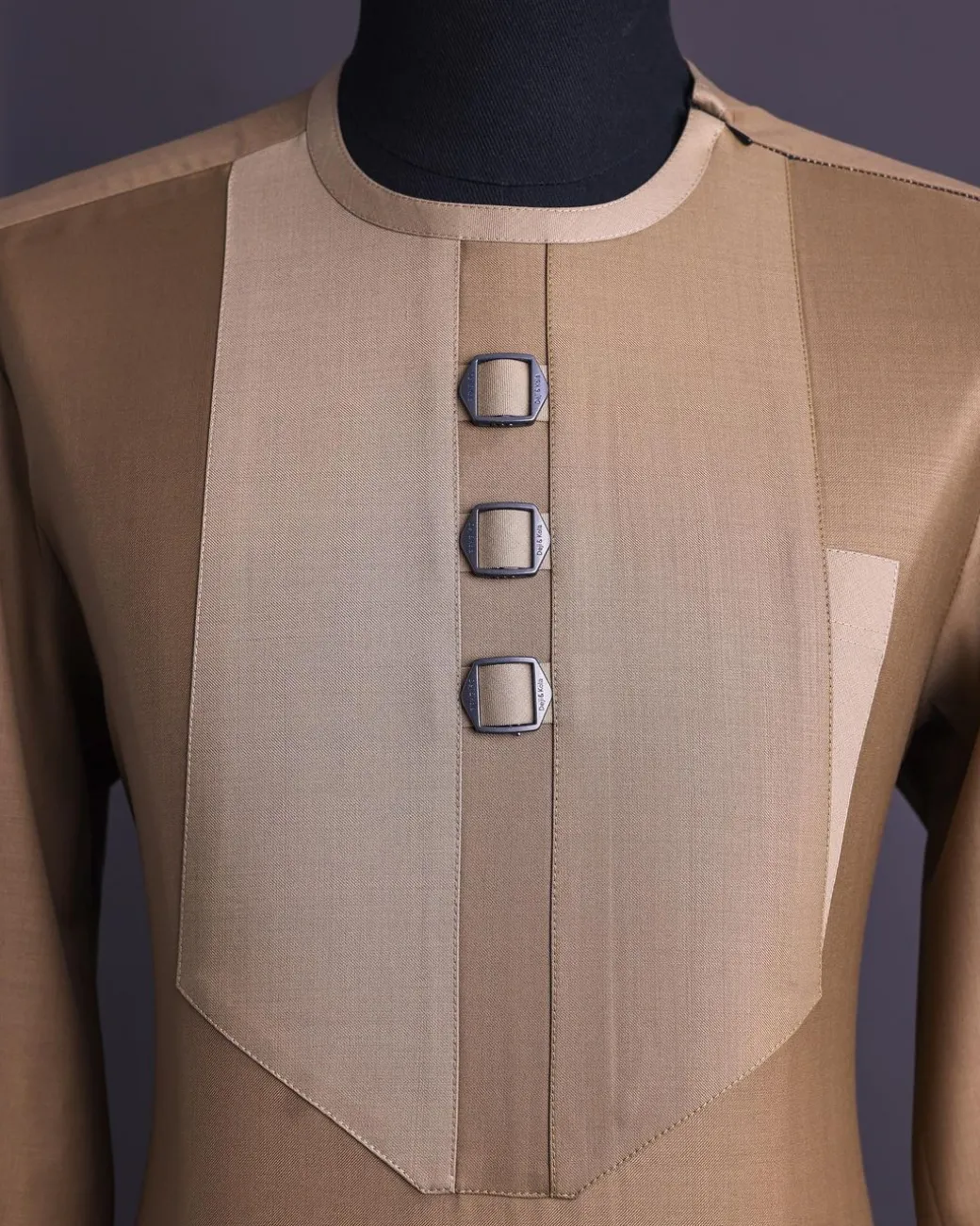 A Tortilla brown, invisible zip, black connected metal tag, 3/4 sleeve traditional african senator kaftan native.