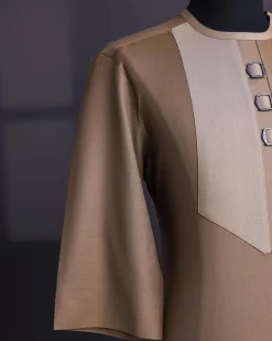 A Tortilla brown, invisible zip, black connected metal tag, 3/4 sleeve traditional african senator kaftan native.