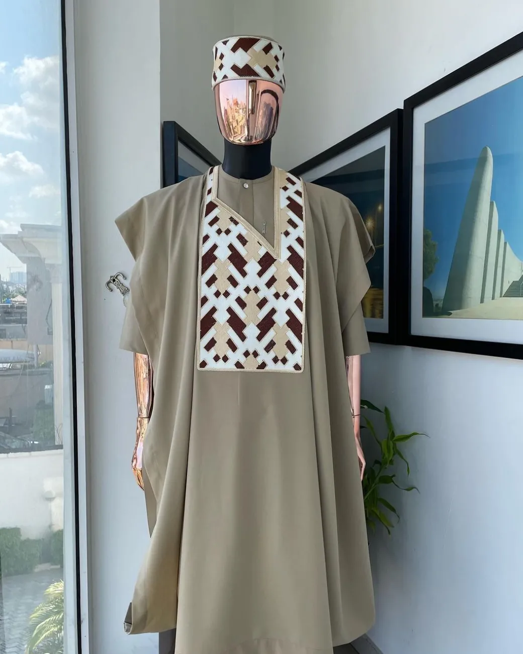 A Tortilla brown, layered tettri pattern embroidery detailing agbada