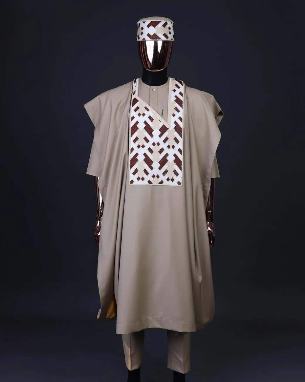 A Tortilla brown, layered tettri pattern embroidery detailing agbada