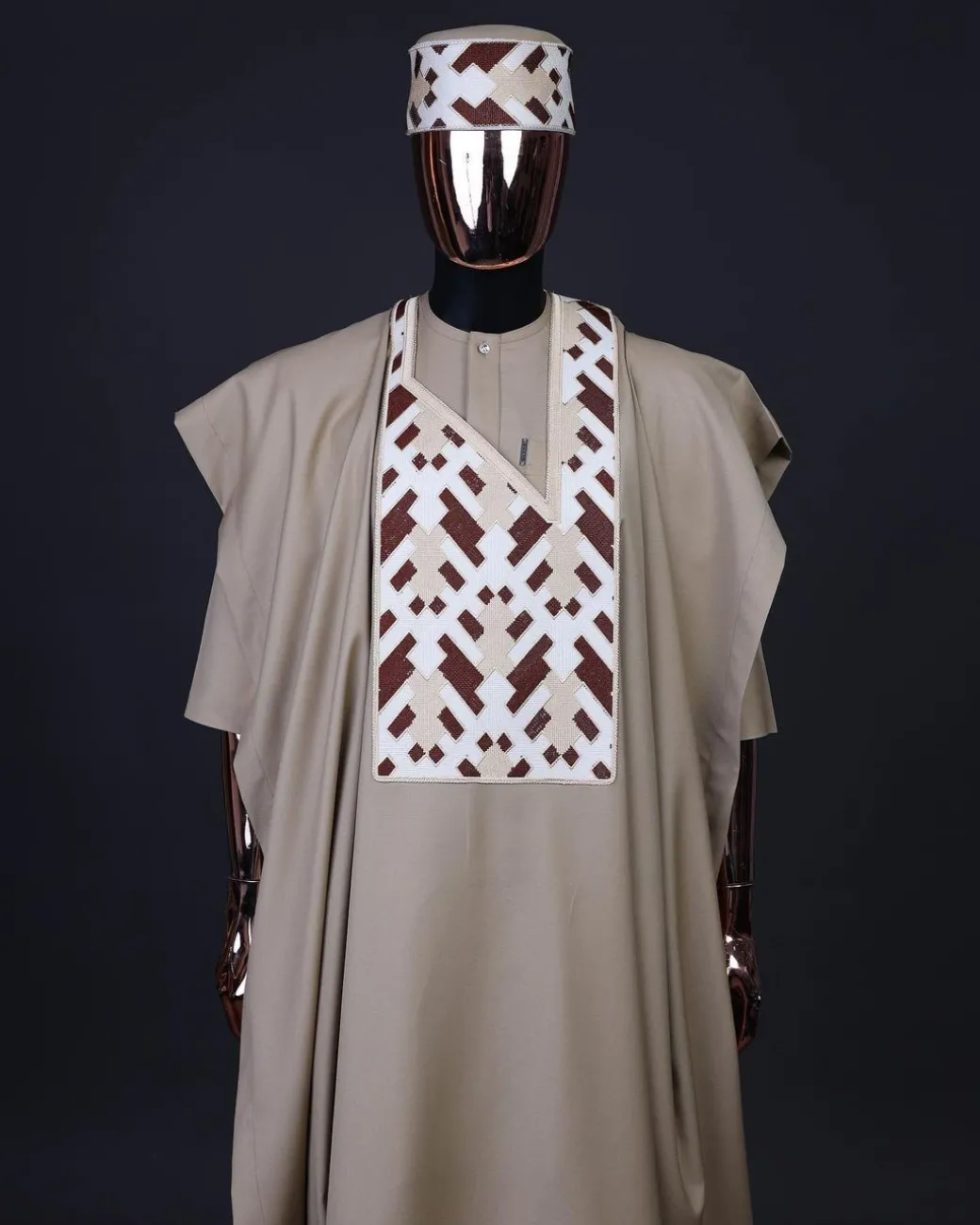 A Tortilla brown, layered tettri pattern embroidery detailing agbada