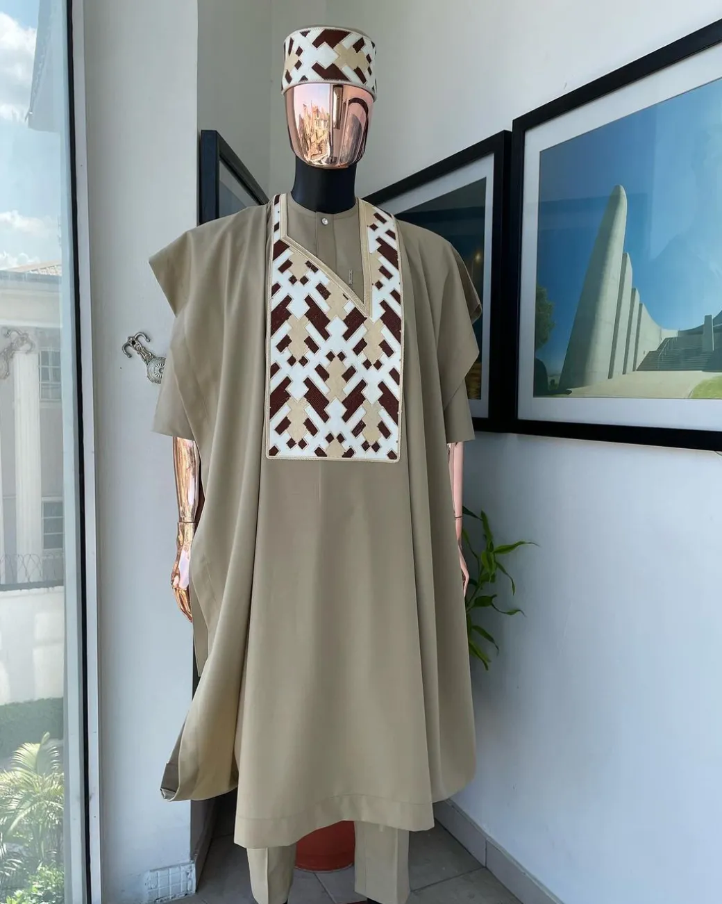 A Tortilla brown, layered tettri pattern embroidery detailing agbada
