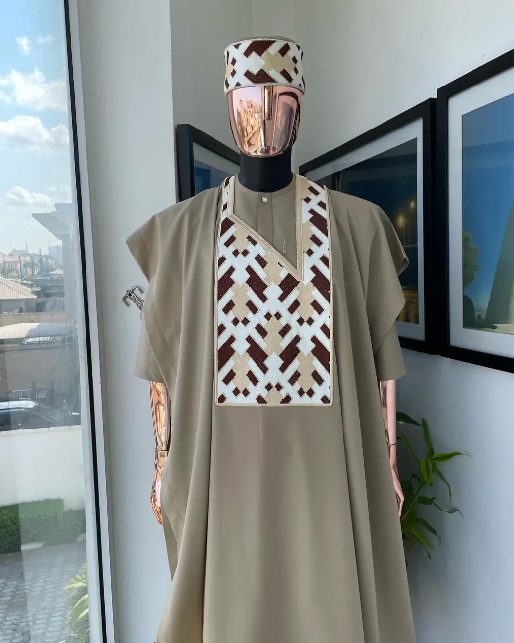 A Tortilla brown, layered tettri pattern embroidery detailing agbada