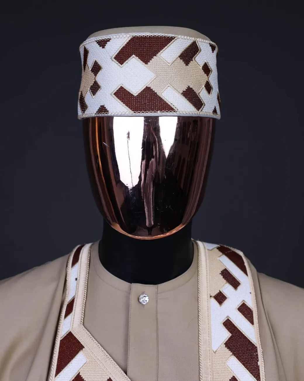 A Tortilla brown, layered tettri pattern embroidery detailing agbada