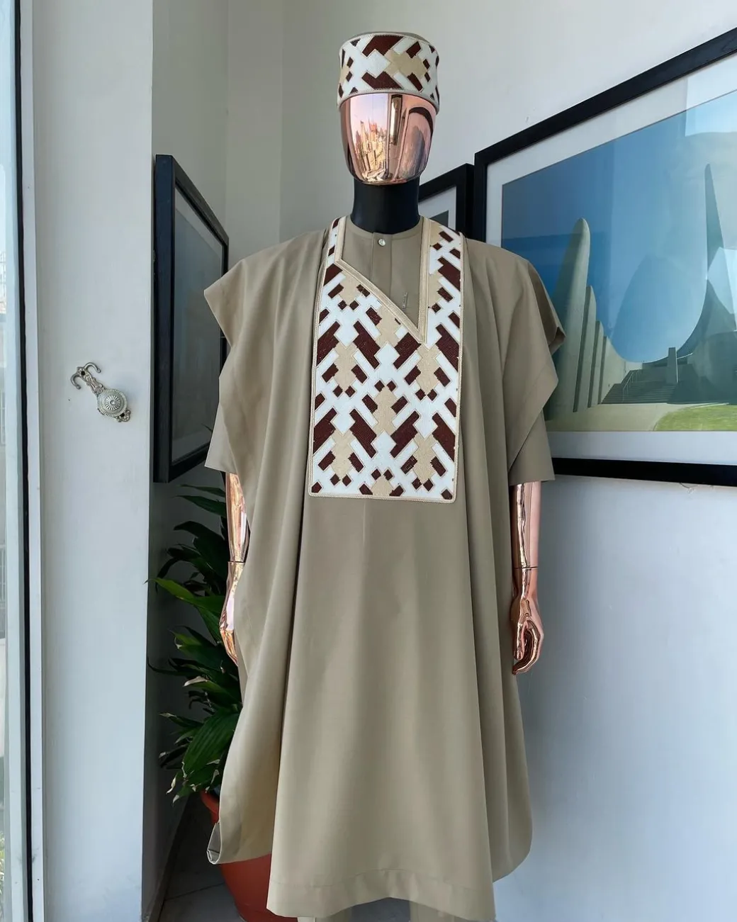 A Tortilla brown, layered tettri pattern embroidery detailing agbada
