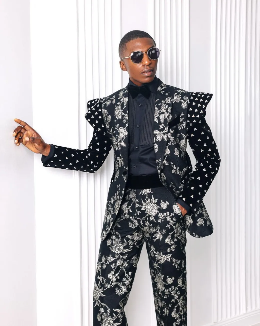 A “Vegas 2”, Floral pattern jacquard, Elevated shoulder and sleeve with Swarovski details peak Lapel tux suit