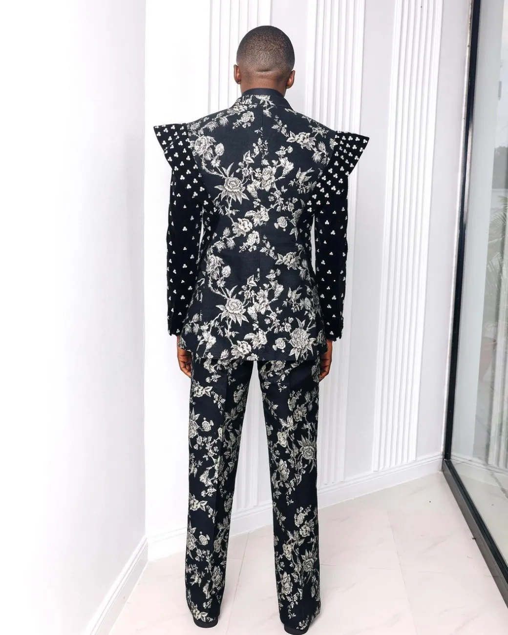 A “Vegas 2”, Floral pattern jacquard, Elevated shoulder and sleeve with Swarovski details peak Lapel tux suit