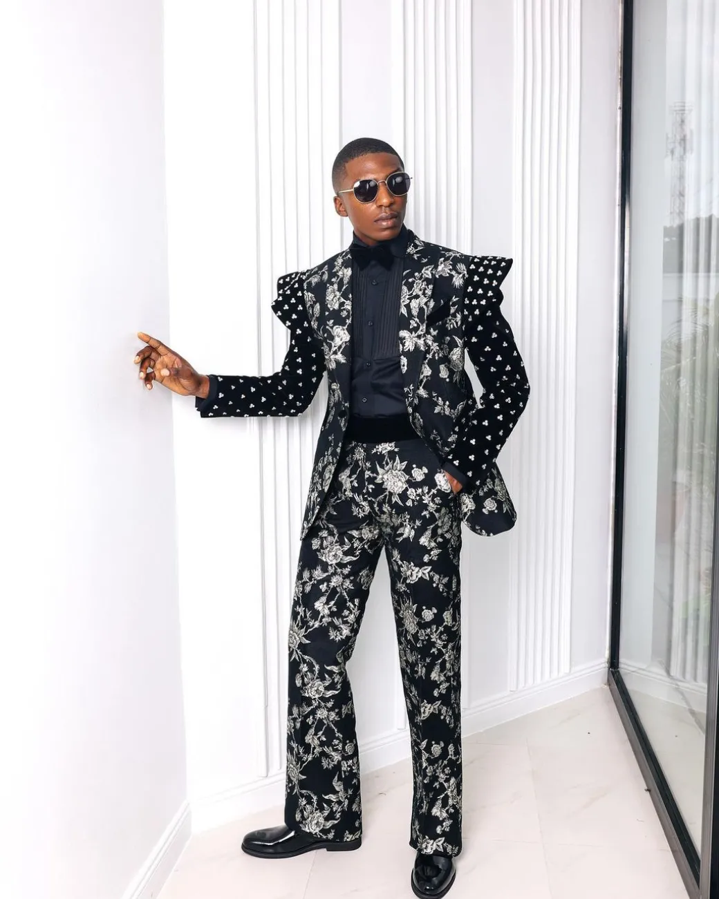 A “Vegas 2”, Floral pattern jacquard, Elevated shoulder and sleeve with Swarovski details peak Lapel tux suit