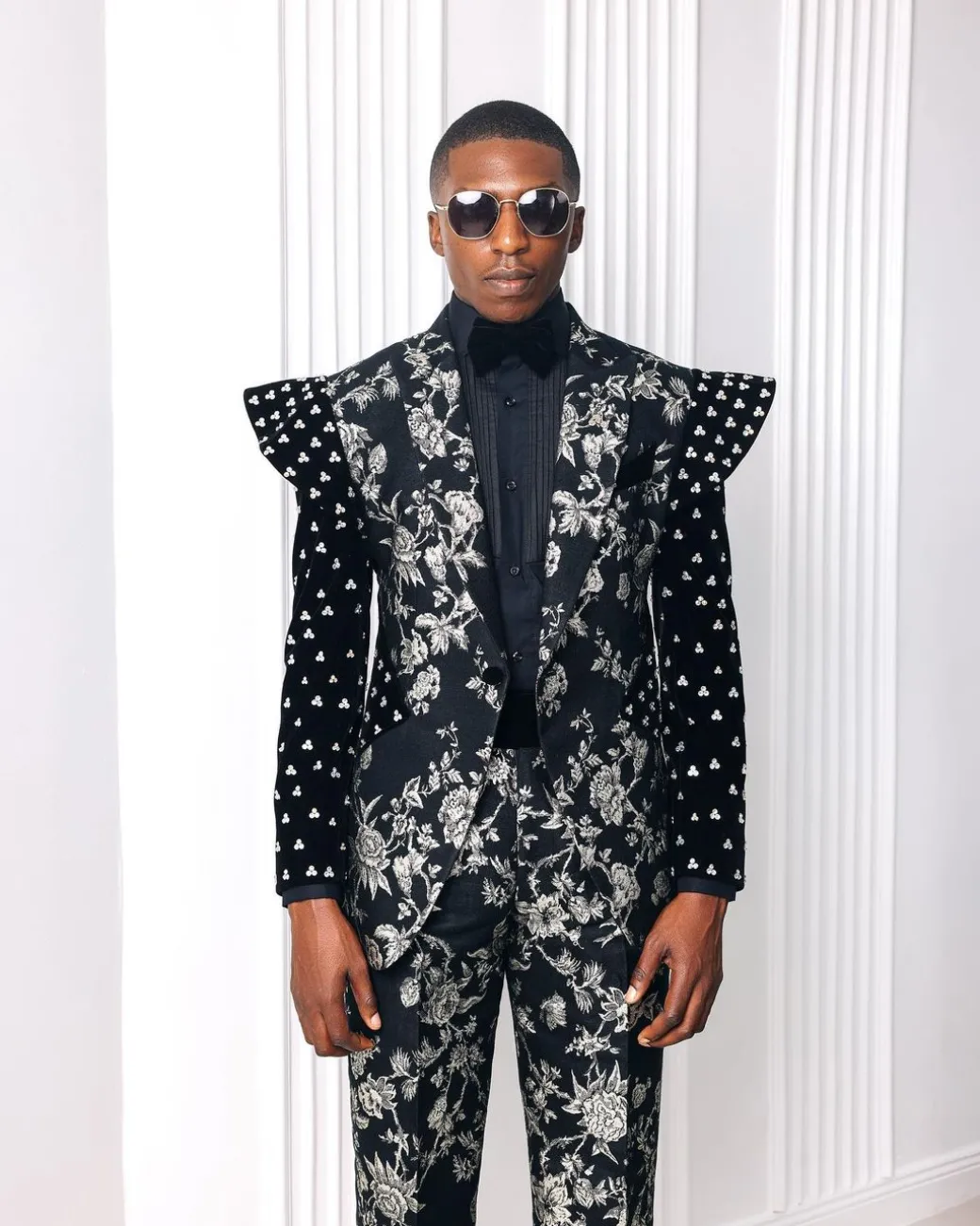 A “Vegas 2”, Floral pattern jacquard, Elevated shoulder and sleeve with Swarovski details peak Lapel tux suit