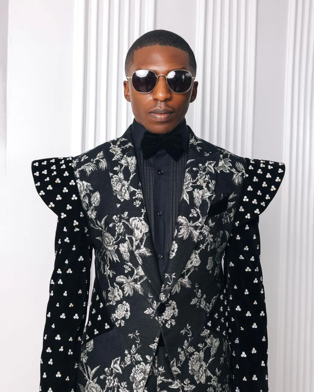 A “Vegas 2”, Floral pattern jacquard, Elevated shoulder and sleeve with Swarovski details peak Lapel tux suit