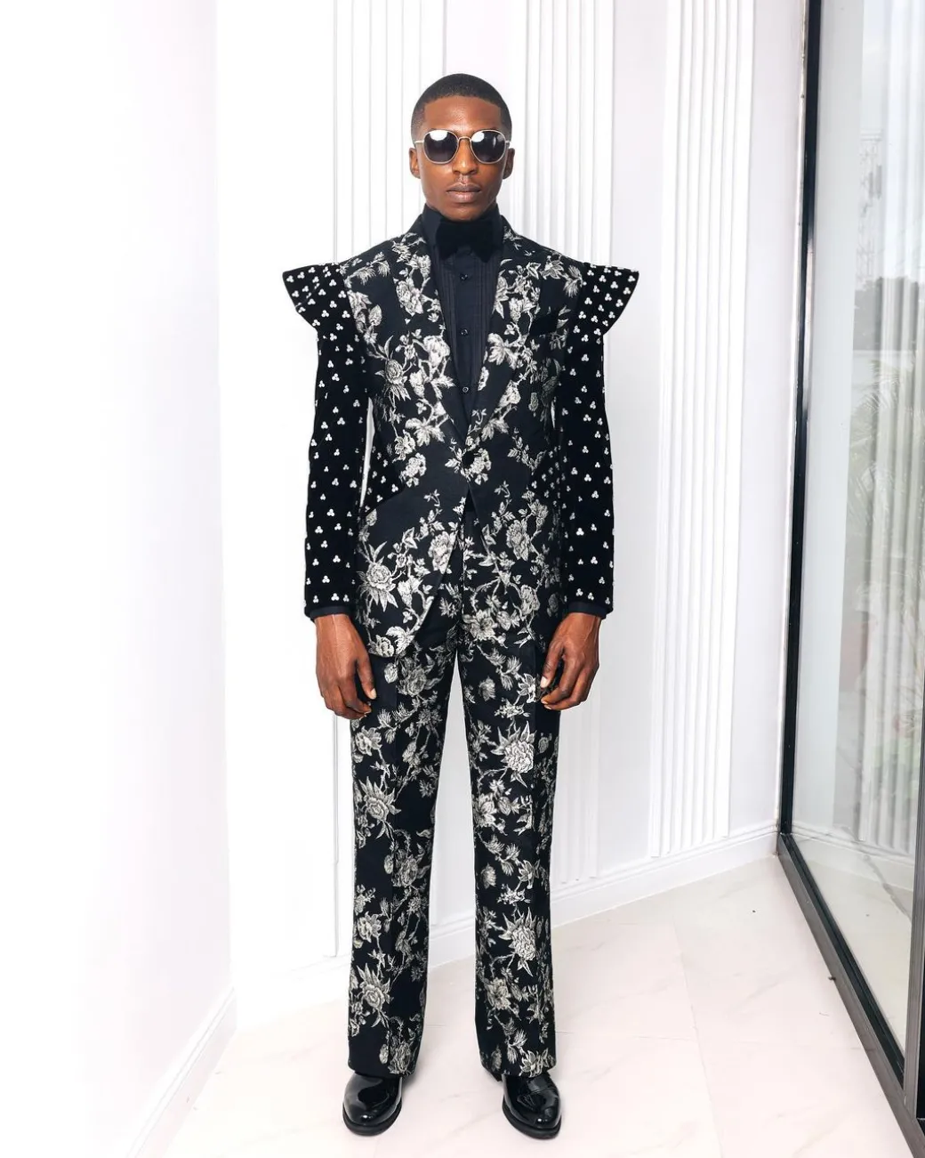 A “Vegas 2”, Floral pattern jacquard, Elevated shoulder and sleeve with Swarovski details peak Lapel tux suit