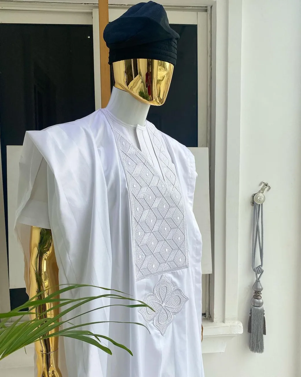 A voil jacquard cocaine white with an aligned square pattern design Agbada