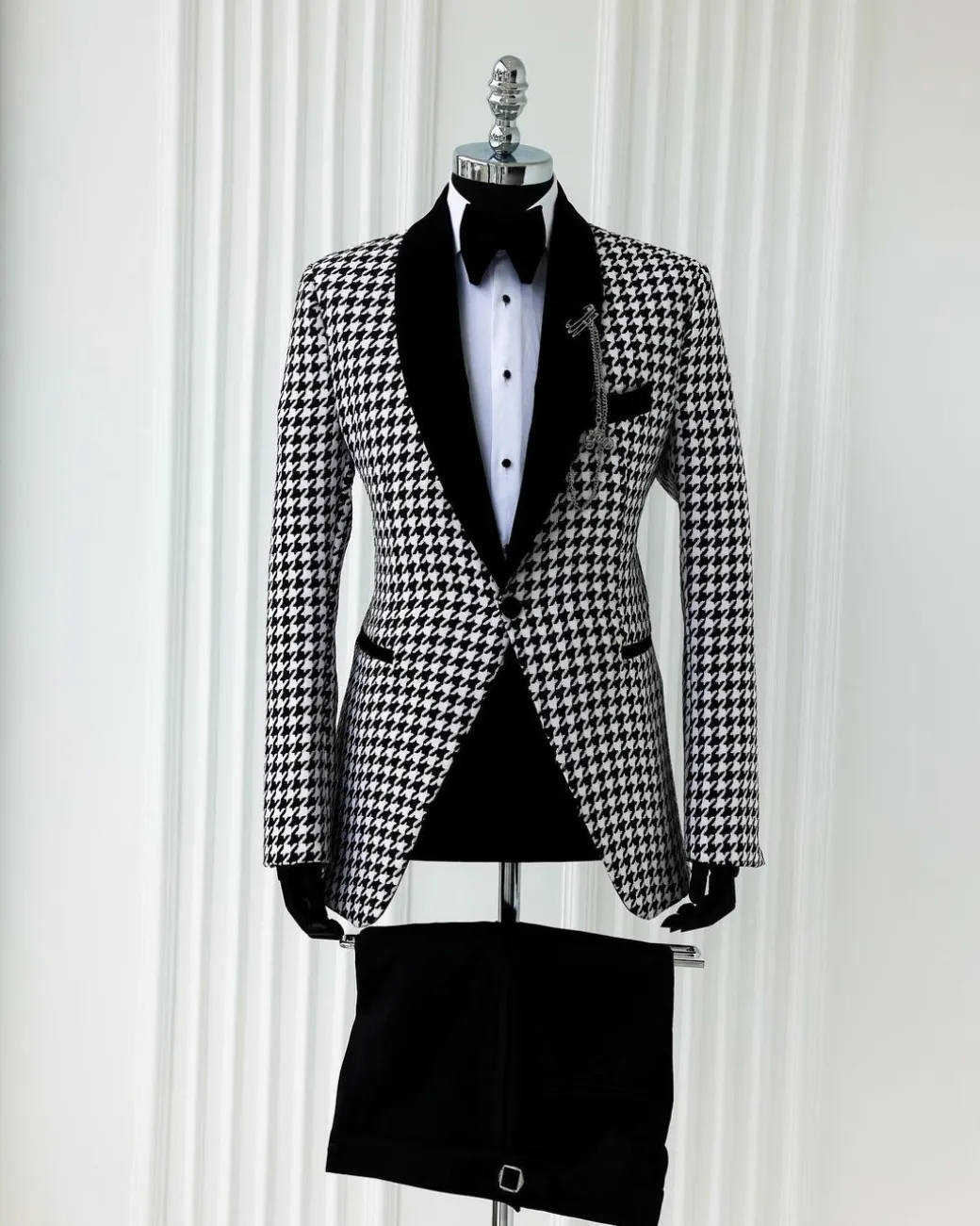 A White and black houndstooth, velvet shawl lapel tuxedo suit