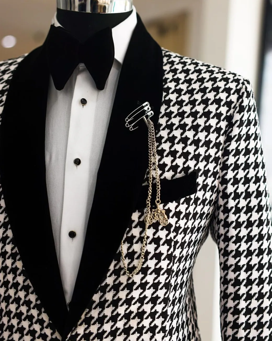 A White and black houndstooth, velvet shawl lapel tuxedo suit