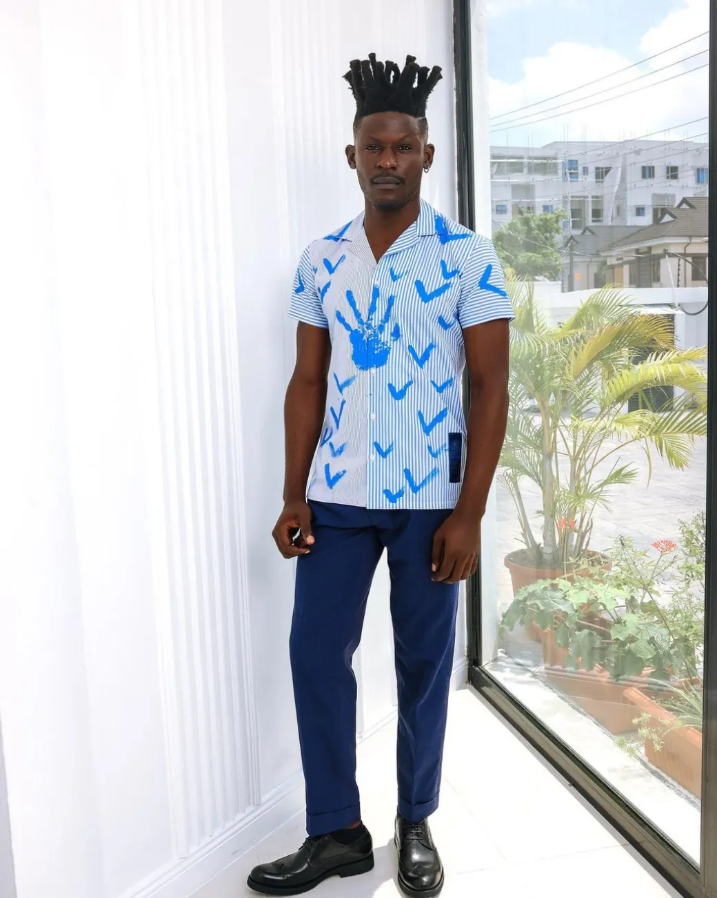 A White And Blue Mixed Hand Pattern Paint Stripe Shirt.