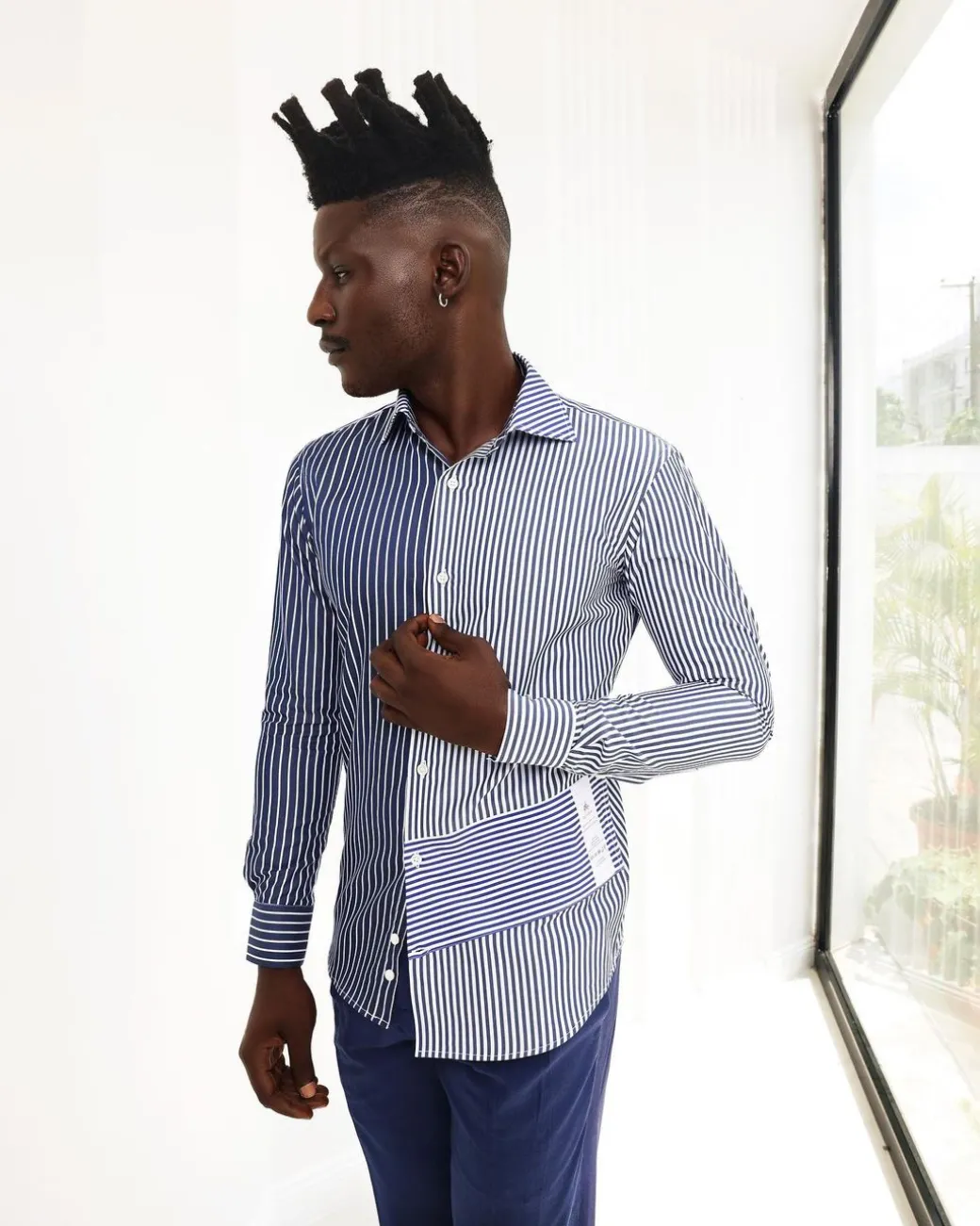 A White And Blue Mixed Stripe Shirt.