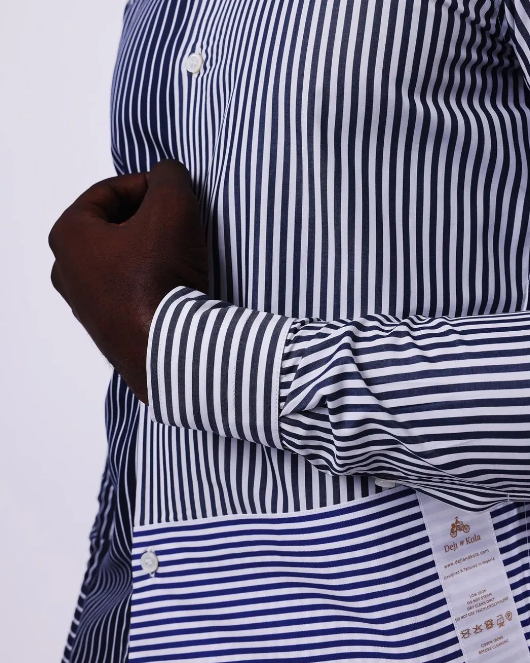 A White And Blue Mixed Stripe Shirt.