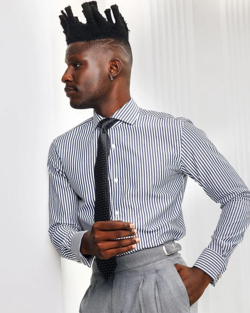 A White and blue stripe, cut-away collar business shirt.